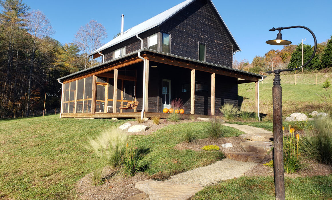 Scandinavian style barn renovation with modern landscaping